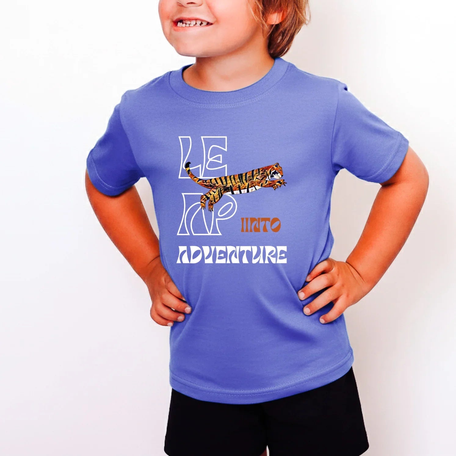 Child wearing a blue t-shirt with a graphic and text on a white background