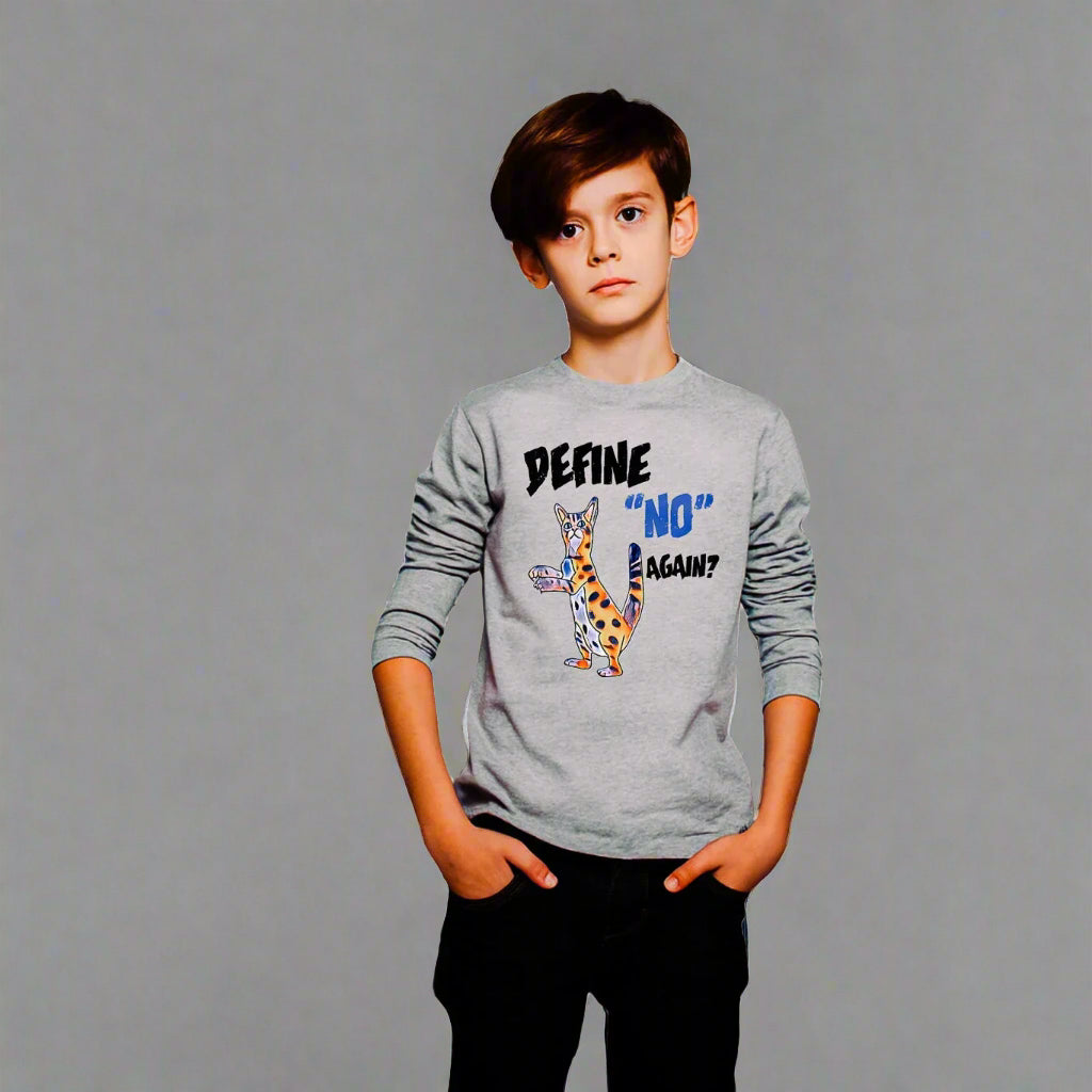 Child wearing a gray t-shirt with a graphic design against a white brick wall.
