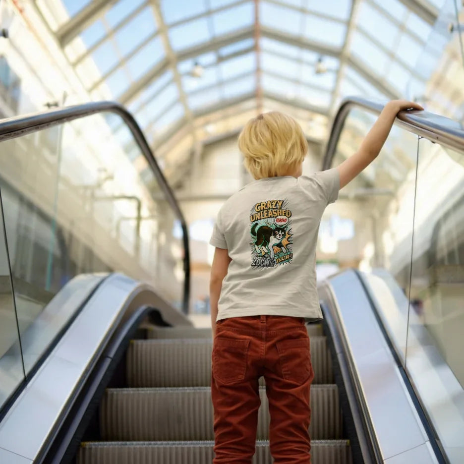 Person on an escalator wearing a t-shirt with a graphic design